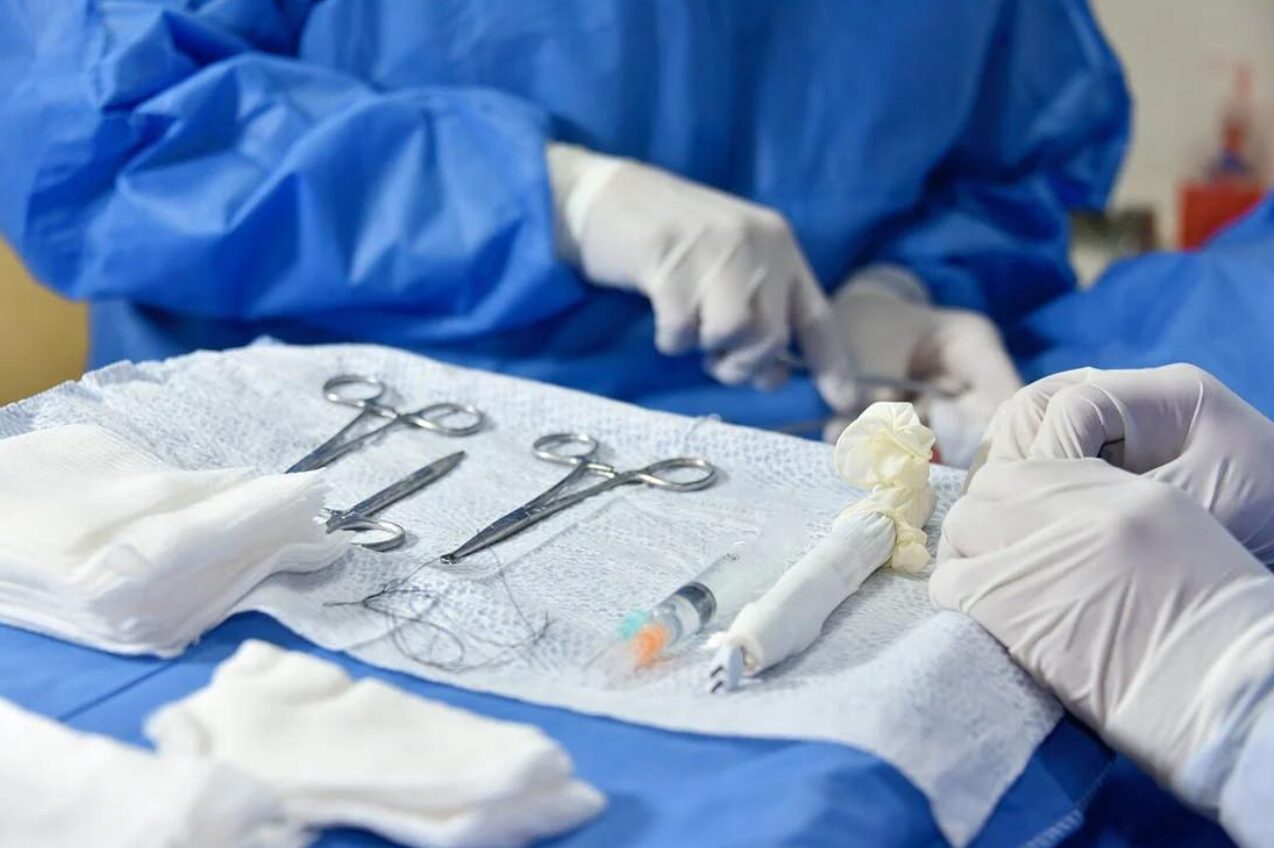 A group of plastic surgeons performing a surgery