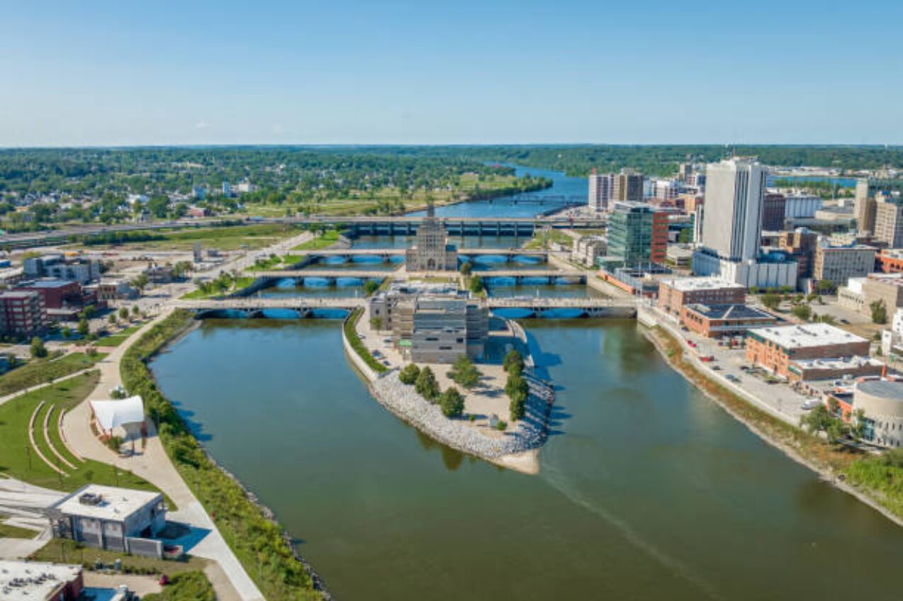 Aerial view of Ames, IA, showing downtown and surrounding waterways.